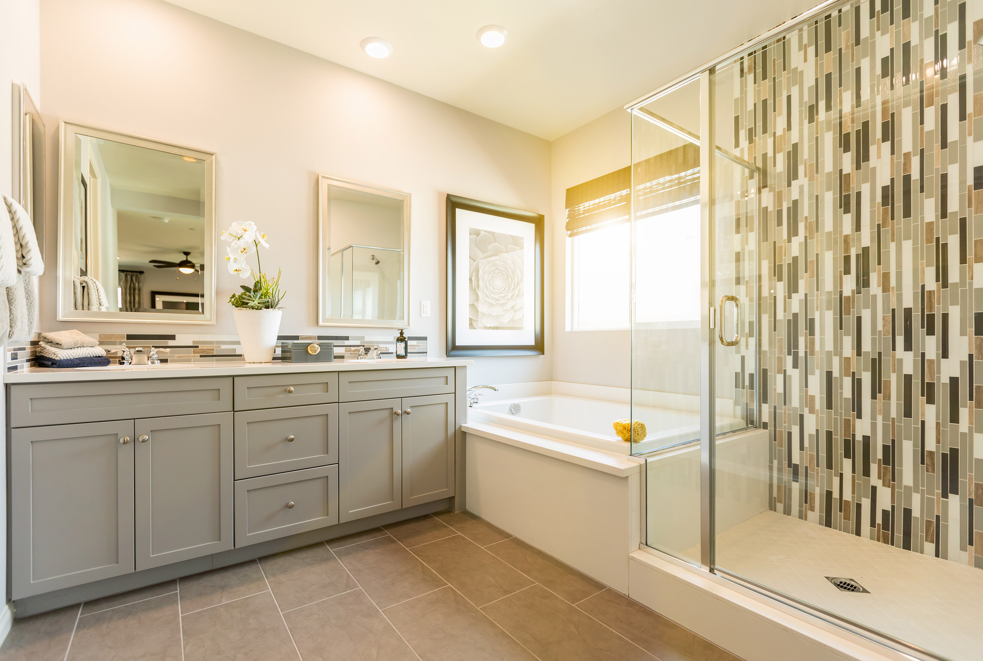 New bathroom with glass shower and large tub